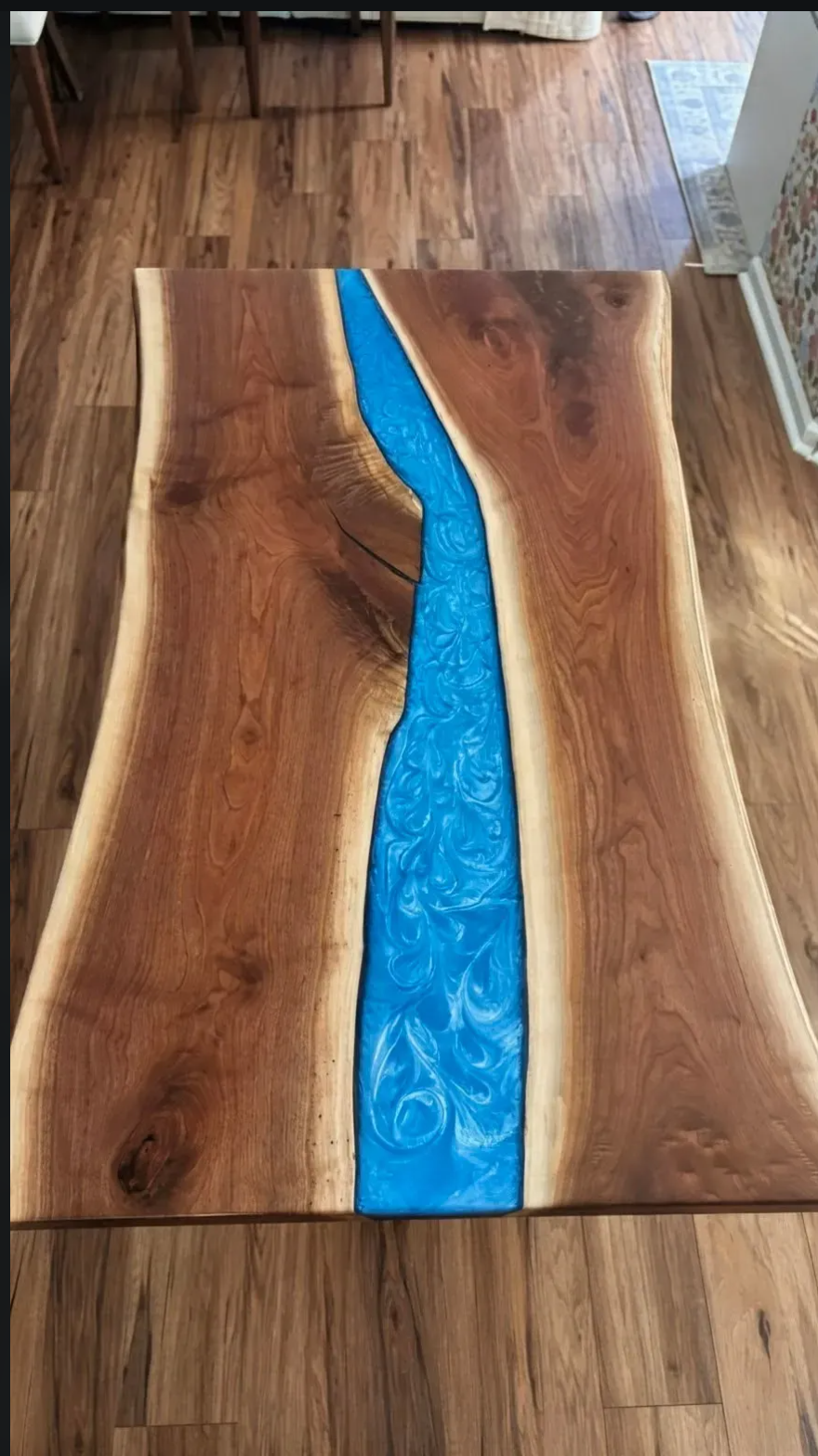 Live edge walnut table with vivid blue resin river